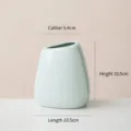 Vaso moderno minimalista in ceramica verde menta con apertura obliqua e dimensioni - Bocca Curva Piccola (Blu Chiaro) / Calibro 5.4cm Altezza 10.5cm Lunghezza 10.5cm