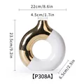 Modern luxury gold and white ceramic donut vase shown with dimensions 23.5cm in height - White Gold Large (P308A) / 22cmx23.5cmx6.5cm
