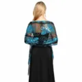 Detailed back view of black mesh shawl with turquoise sequin floral embroidery and fringe. - Black and Lake Blue