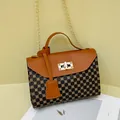 Elegant brown contrast chain shoulder bag with vintage pattern and gold lock closure - Tan