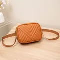 Elegant brown quilted chevron camera bag crossbody with an adjustable canvas strap - Tan