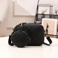 Chic black quilted crossbody bag set with matching round coin purse and gold hardware. - Grid Black