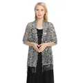 Detailed view of an elegant silver sequin floral lace shawl with long tassels on a model - Dark Gray