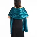 Elegant dark teal satin shawl wrap shown from the back over a black evening dress - Teal
