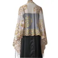 Detailed view of elegant peacock embroidery and gold sequins on a sheer shawl - White + Gold
