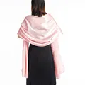 Elegant pink satin shawl detail showing smooth texture on back of evening dress - Light Pink