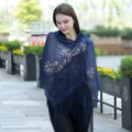 Detailed view of navy blue lace shawl with elegant floral patterns and fringe - Navy Blue