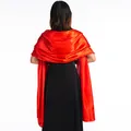 Back view of a vibrant red satin shawl draped over a black formal evening dress - Red
