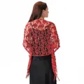 Detailed back view of a red sequin paisley lace shawl paired with a black evening gown - Red