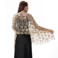 Detailed view of gold paisley sequined shawl with intricate embroidery and elegant tassels. - Gold