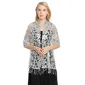 Detail view of a silver floral lace shawl with sequins and elegant tassels for evening wear - Light Silver