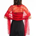 Close-up detail view of elegant red hollow-out floral lace shawl with fringe tassels - Red