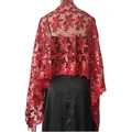 Detail of red sequined lace shawl with floral embroidery and elegant fringe tassels - Red