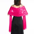 Elegant magenta evening shawl wrap shown draped over the back of a black party dress - Rose Red