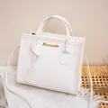 Elegant white lychee grain leather handbag with gold logo and shoulder strap - White