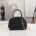 Glossy black jelly shell handbag mini studded crossbody handbag with a gold chain strap - Black