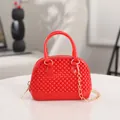 Mini red jelly shell handbag with gold chain strap and textured surface pattern - Red