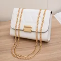 White quilted crossbody chain bag with triangular embroidery and gold metal clasp - White