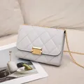Elegant white quilted small square crossbody bag with gold chain strap and metal lock - Gray