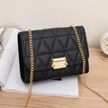 Quilted triangle pattern black chain crossbody bag with elegant gold hardware lock. - Black