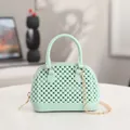 Trendy mini mint green jelly shell handbag featuring pearl texture and gold chain strap - Green