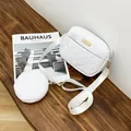 White quilted crossbody bag with matching round coin purse on a minimalist wooden desk. - Quilted 2-in-1 Style (L394 with Round Bag) / White