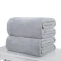 Premium soft light grey flannel fleece blanket folded and stacked in a set of two - 70x100cm / Silver Gray