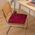 Close-up of a burgundy plush heated seat cushion on a wooden chair in an office setting - Rabbit Plush Style / 40x40cm Standard Type / Wine Red