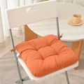 Detailed view of an orange thickened fabric chair cushion with ties on a white chair - 40*40cm / Orange Red