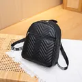 Stylish black quilted mini backpack featuring chevron pattern and gold zip detail - Black