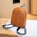 Stylish brown mini backpack with chevron quilted pattern and lettered woven strap - Tan