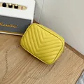 Stylish yellow quilted crossbody camera bag with elegant gold chain strap - Yellow