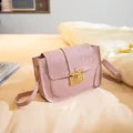 Elegant pink stone pattern crossbody handbag featuring a vintage gold bee clasp lock. - Pink