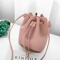 Soft pink lychee grain leather drawstring bucket bag for women with gold accents - Pink