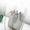 Fashionable grey lychee pattern faux leather drawstring bucket bag for women crossbody use - Gray