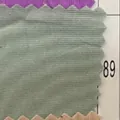 Detailed close-up of grey-green corduroy fabric swatch for chair cushions, color 89 - Light Green (89)