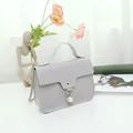 Elegant grey crossbody square bag with pearl charm and top handle. - Nappa Texture Gray