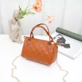 Classic brown quilted pillow bag with double top handles and gold chain shoulder strap - Brown
