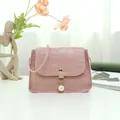 Elegant pink stone pattern mini crossbody bag featuring a delicate pearl pendant detail. - Pink Crocodile Pattern