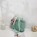 Elegant mint green patterned shoulder bag featuring a stylish silk scarf accessory detail. - Green