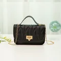 Stylish black quilted PU leather chain handbag with an elegant gold-tone lock. - Black