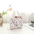 Stylish marble pattern white handbag with gold chain strap and decorative silk scarf - White