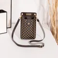 Brown patterned vertical crossbody phone bag for women with adjustable shoulder strap. - Monogram Print Style / Coffee