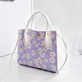 Stylish purple and white color-block handbag with daisy print and shoulder strap - Daisy Style / Purple