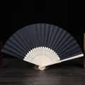 Vista detallada de un abanico plegable DIY de 7 pulgadas en papel negro y bambú. - Negro