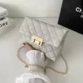 Stylish light grey quilted square crossbody bag featuring a gold chain strap and lock - Light Gray