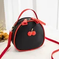 Chic mini black and red cherry crossbody bag featuring a stylish lychee grain texture - Black