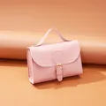 Elegant pink croc-embossed handbag for women featuring top handle and buckle details - Pink