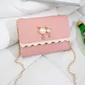 Elegant small pink chain crossbody bag featuring a cute pearl cat ornament for women - Pink (Leather)
