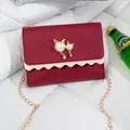 Red small crossbody bag featuring a gold chain strap and cute cat pearl ornament detail - Red (Leather)